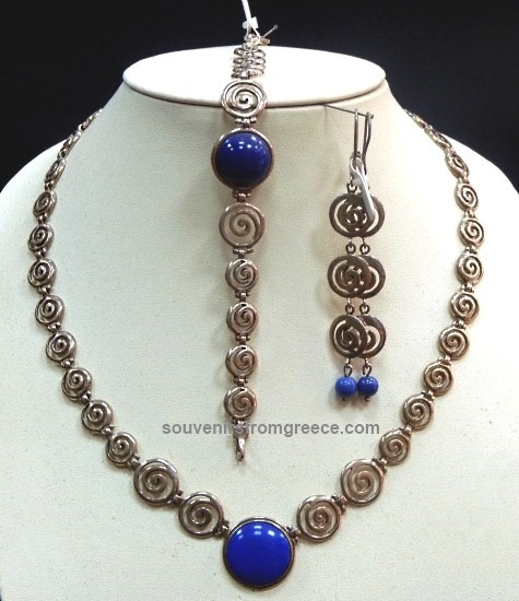 Souvenirs from Greece: GREEK SPIRAL JEWELLERY SET Greek jewellery Jewellery Sets Stunning handmade greek spiral jewellery set, the circle of life, from sterling silver. The set includes greek spiral neckace with a blue artificial stone (lapis), matching bracelet and earings.