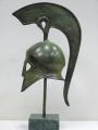 Souvenirs from Greece: Spartan helmet greek bronze statue 
 Greek statues Bronze statues Fantastic greek art souvenirs handmade greek bronze statue of a spartan helmet, worn by Spartan warriors in battle like the battle at Thermopylae between 300 Spartan hoplites lead by Leonidas and the Persians. The bronze sculpture sits on a marble base, the perfect greek art decorative gift.