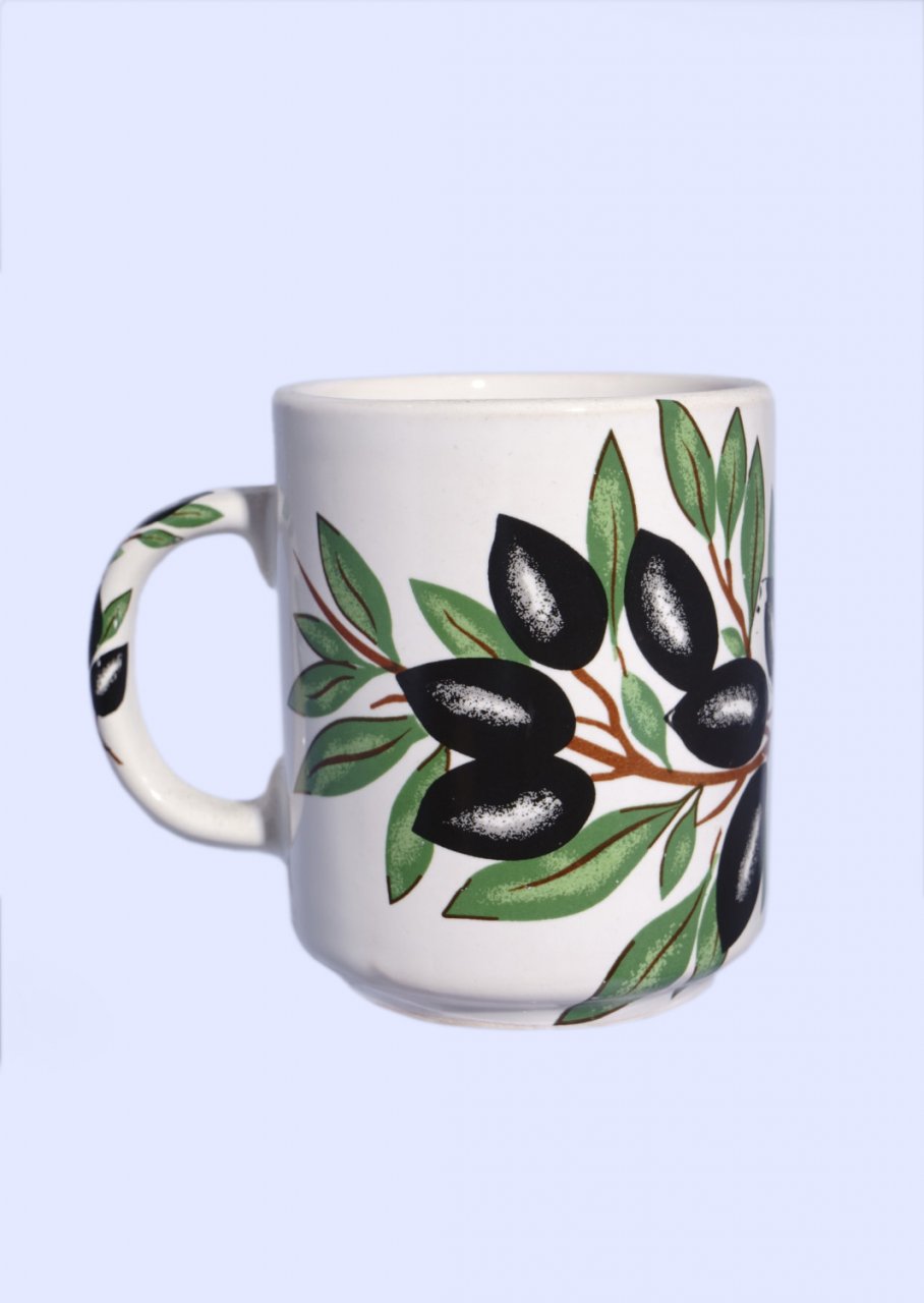 Porcelain mug with olives and olive leaves