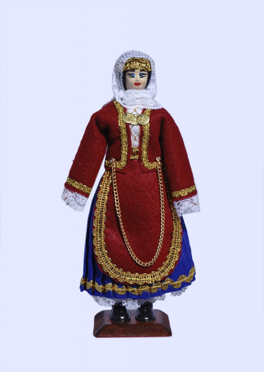 Handmade small doll of a greek woman dressed in traditional costume from Salamis