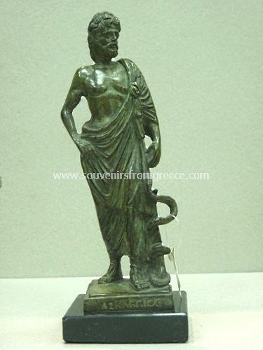 Souvenirs from Greece: Asclepius (Askepios) greek bronze statue Greek statues Bronze statues Magnificent greek souvenir handmade greek bronze statue of Asclepius,  god of medicine and healing in ancient greek mythology. The bronze sculpture sits on a black marble base and depicts the god with a snake-entwined staff, a symbol of medicine today. A special greek gift for doctors or physicians.