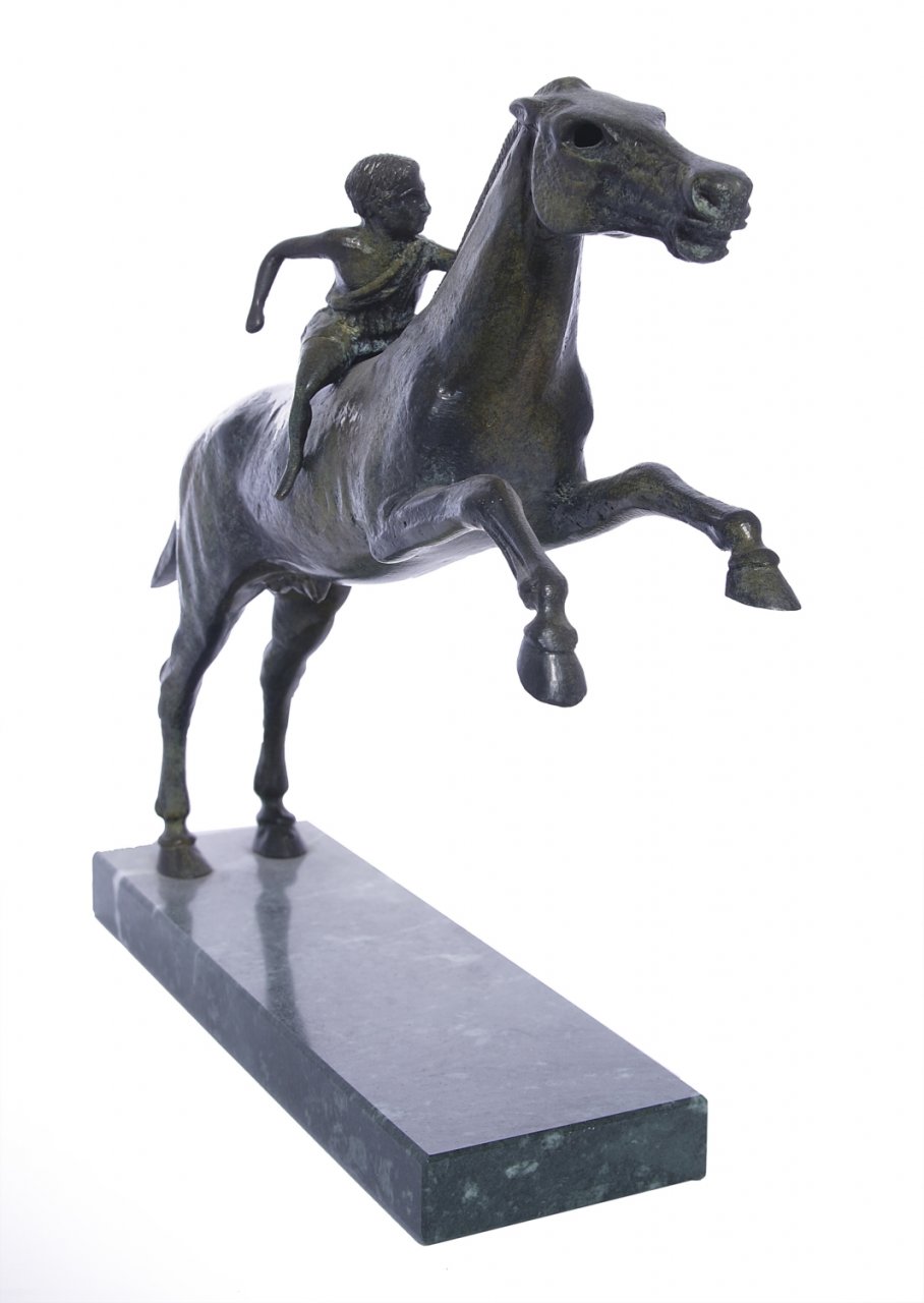 Greek bronze replica statue of Jockey of Artemision on a marble base