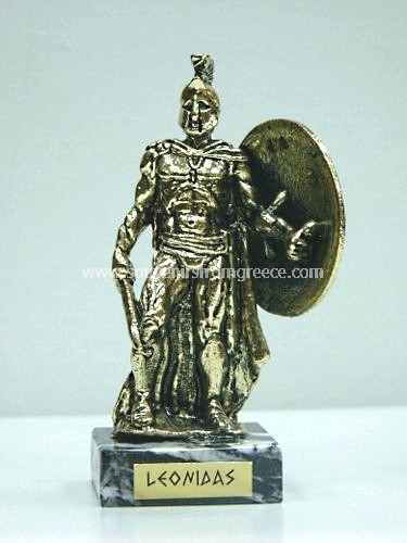 Souvenirs from Greece: Bronze figurine of Leonidas the king of Sparta holding a sword in gold color Greek statues Greek relief sculptures Elegant greek art souvenir handmade greek figurine of Leondias, the Spartan king that fought with 300 Spartan warriors against the Persians in the battle of Thermopyle. The figurine sits on a marble base and depicts Leonidas holding a sword and shield. A special greek gift.